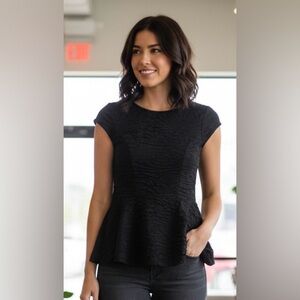 Bar III black stretchy top, flared at waist, mesh on back, great condition, XS